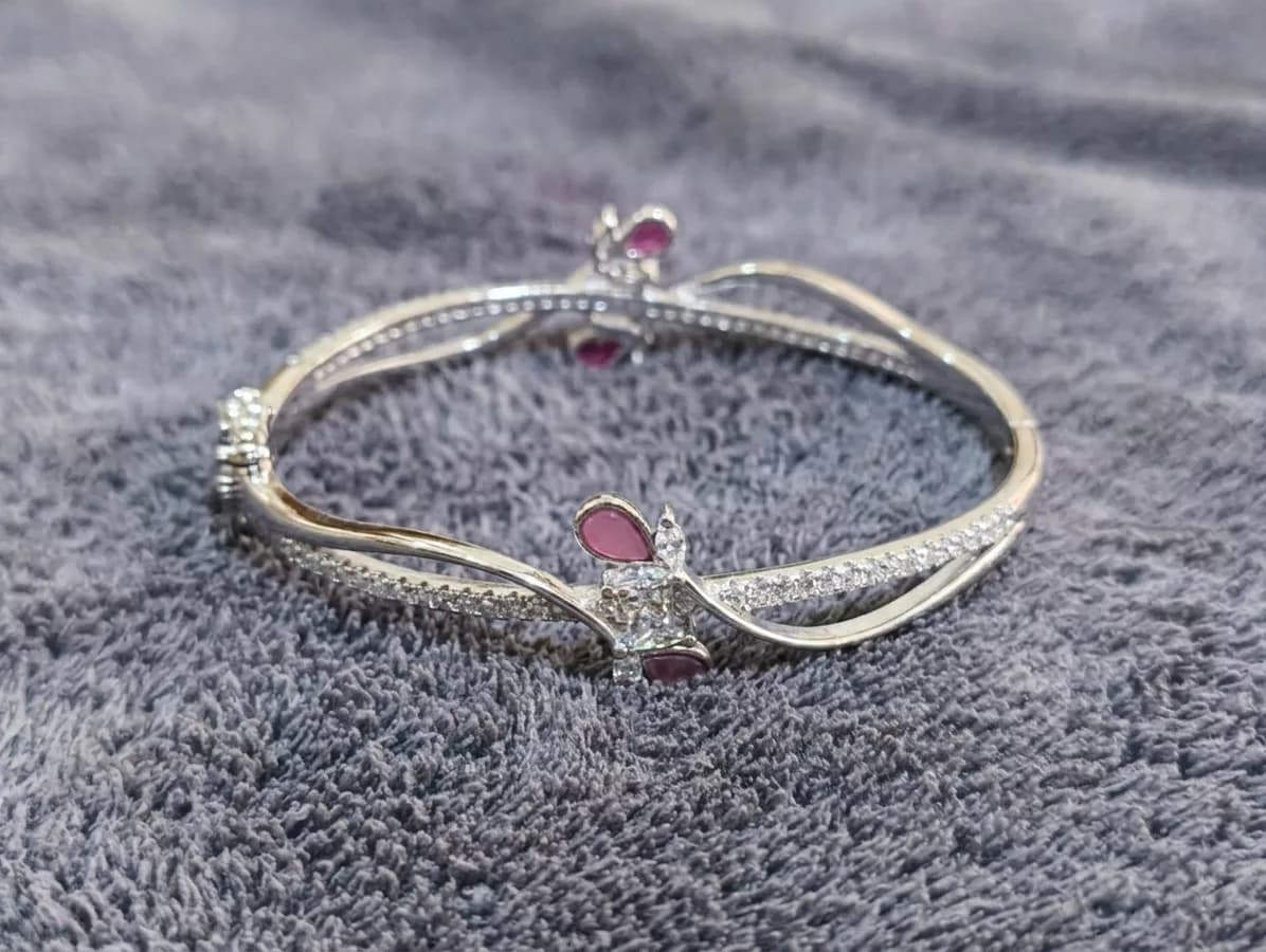 Pink Butterfly Crossover Bangle in silver